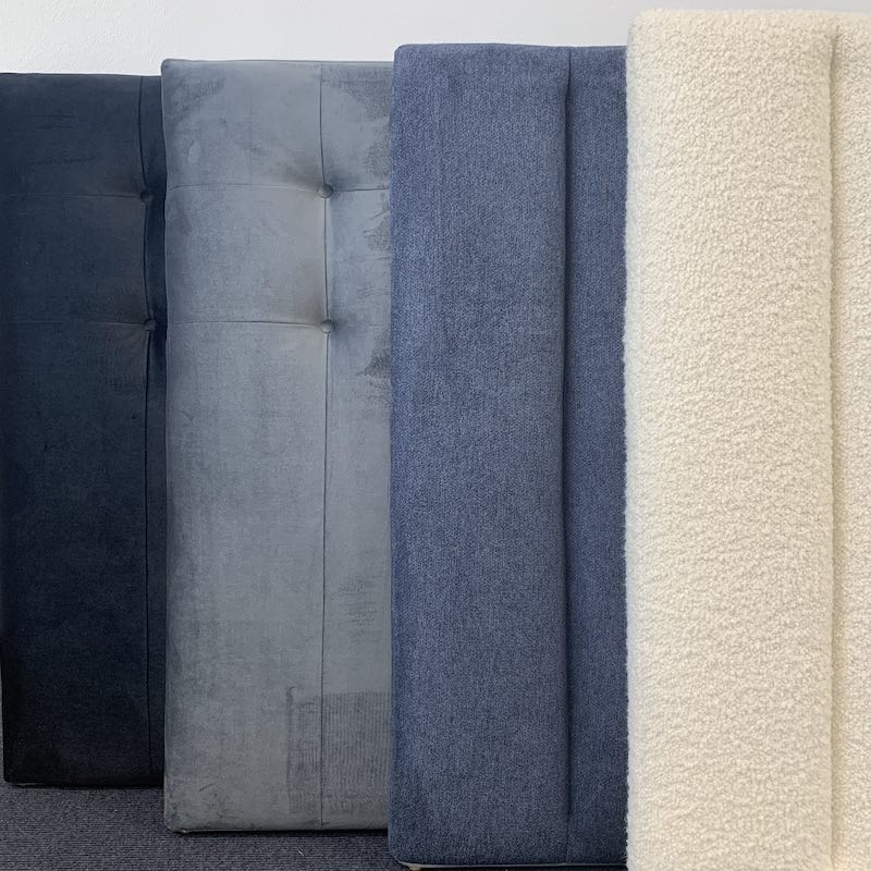 4 headboards stacked in black, grey, blue and cream